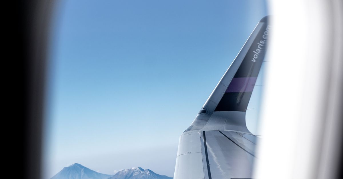 Flight Window Snow Airplane Window View of Snow Covered Mountains · Free Stock Photo