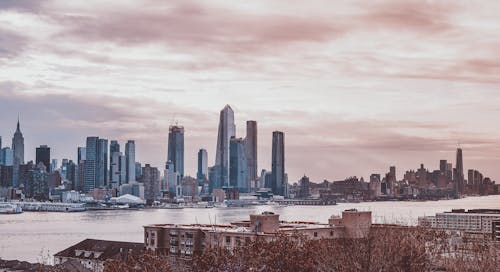 City Skyline Under Cloudy Sky