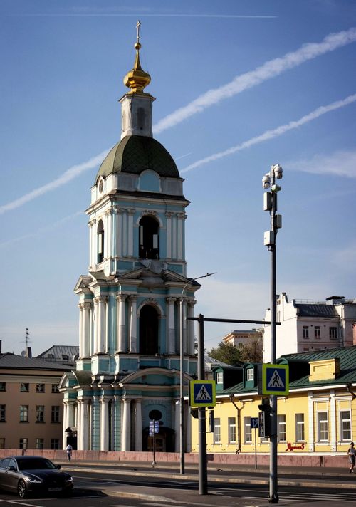 Free Historic bell tower in Moscow with a golden dome under a clear blue sky, showcasing Russian architecture. Stock Photo