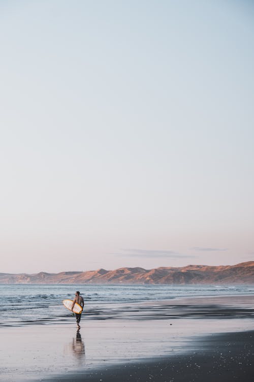 Man Standing on Sea Shore