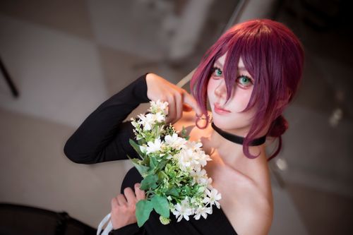 Free Stylish portrait of a woman with purple hair holding white flowers. Stock Photo