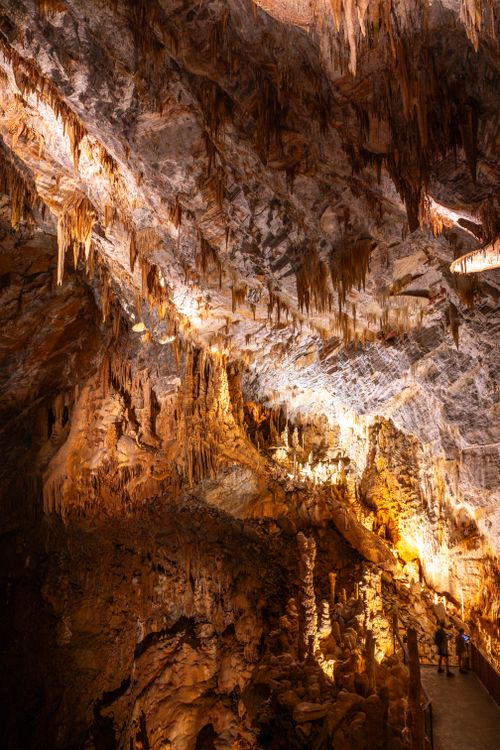 Free Explore the mesmerizing stalactites of Cabrespine Cave in Occitanie, France, captured in warm, dramatic lighting. Stock Photo