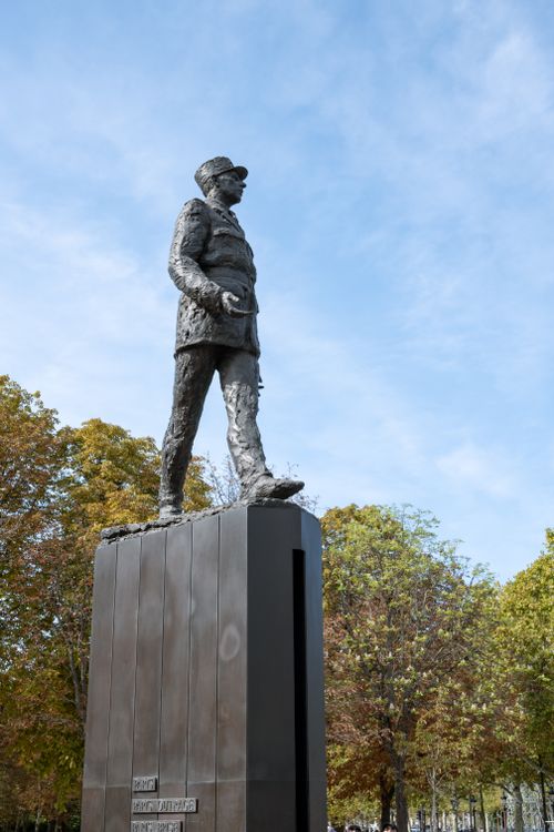 Free Bronze statue of Charles de Gaulle in a Paris park during a sunny day. Stock Photo