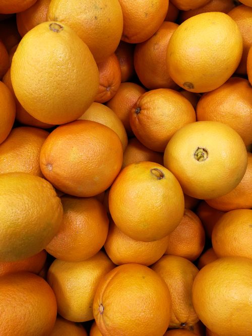 Free A vibrant pile of fresh oranges, showcasing their bright orange hue and natural texture. Stock Photo