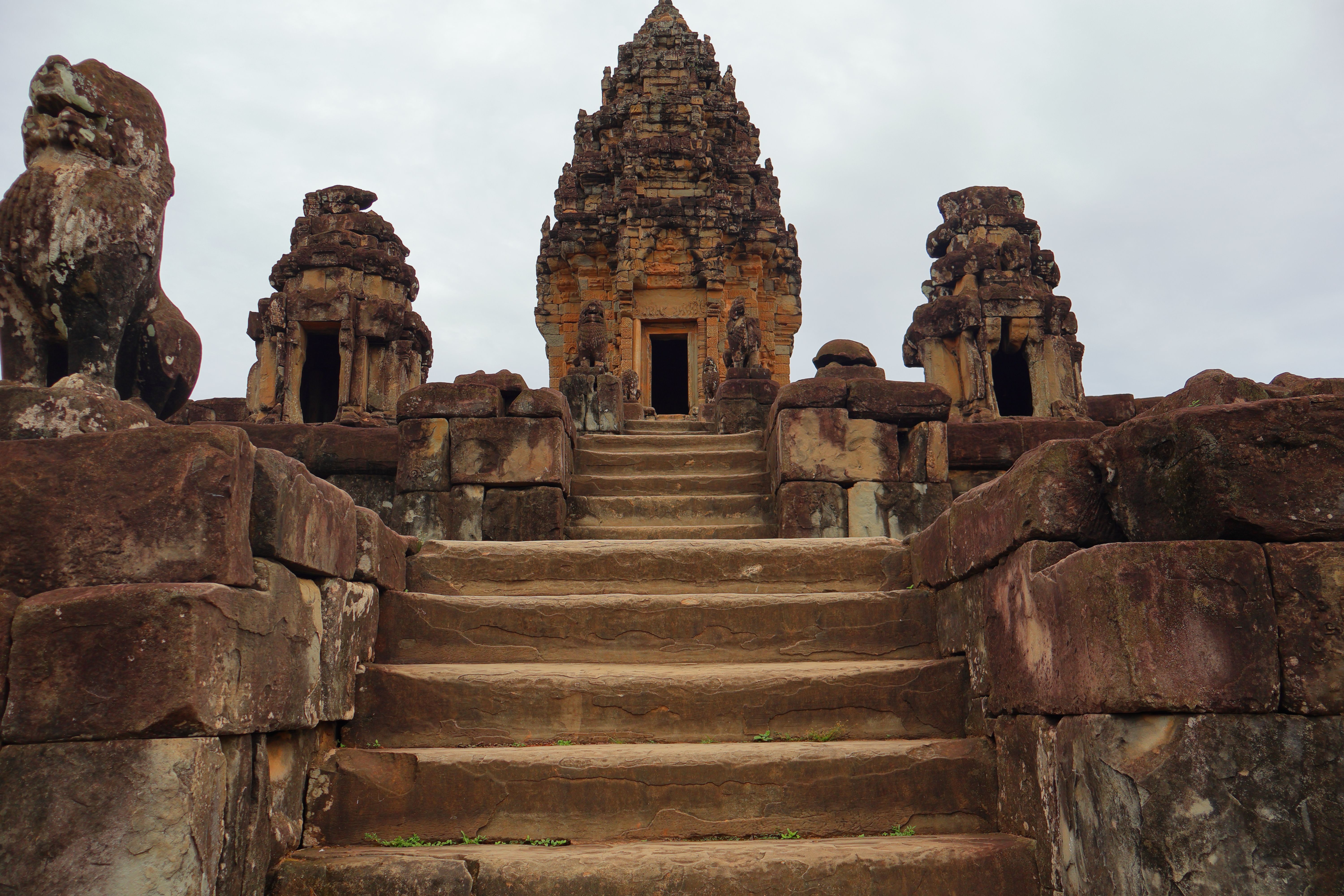Majestic stone structure at the top of ancient temple steps in a historic site, perfect for cultural exploration.