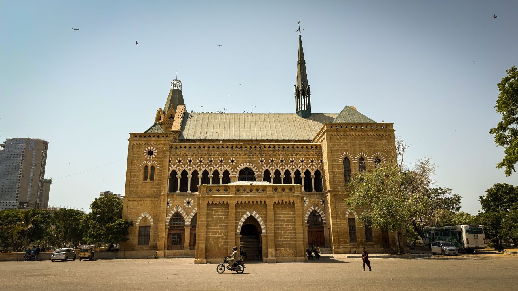 Frere Hall, a prominent colonial-era building in Karachi, stands majestically under a clear sky.