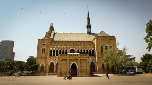 Free Frere Hall, a prominent colonial-era building in Karachi, stands majestically under a clear sky. Stock Photo