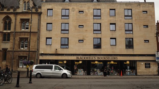 Exterior view of Blackwell's Bookstore on a street in Oxford, England.