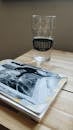 Clear Drinking Glass on Brown Wooden Table