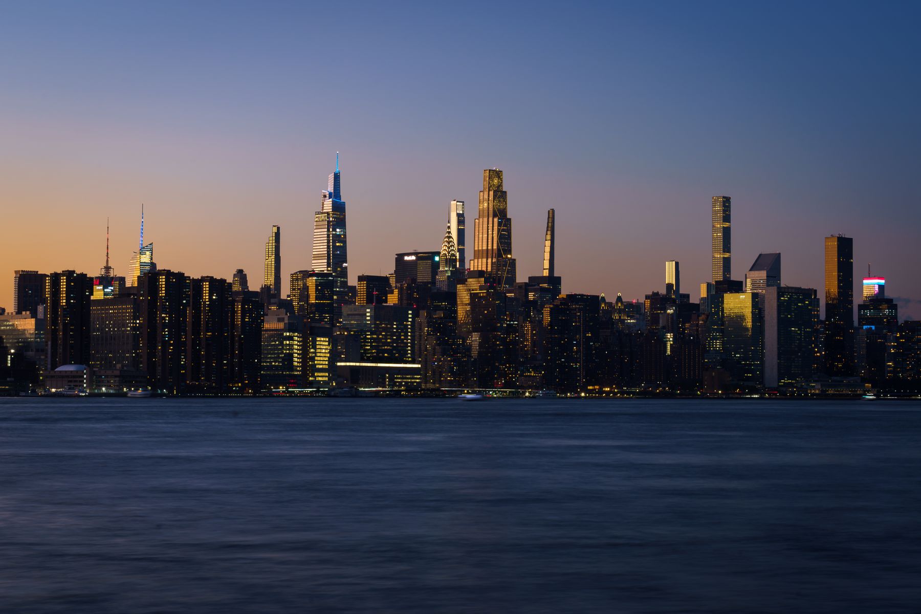 The Midtown Manhattan skyline across the water at dusk