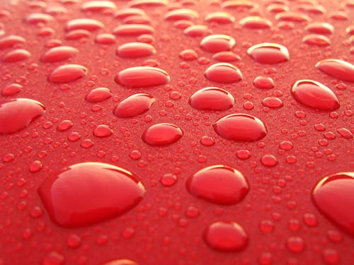 Water Droplets on Red Surface