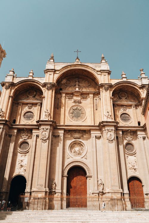 Free Stunning view of the Granada Cathedral facade bathed in sunlight, highlighting its intricate architecture. Stock Photo