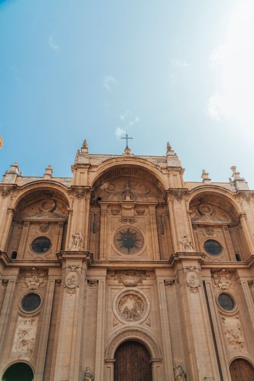 Free Stunning baroque cathedral facade against a clear blue sky during the day. Stock Photo