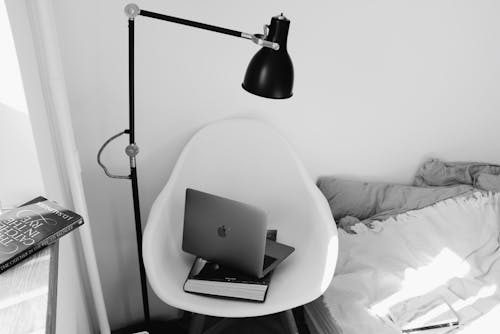 Free Laptop on White Chair Stock Photo