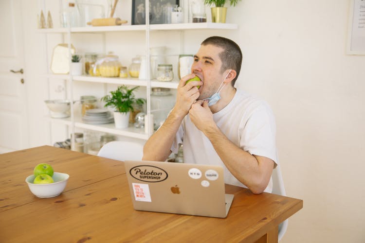 Man Eating Green Apple