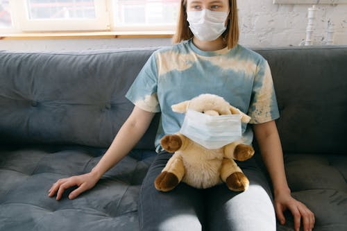 Woman with Her Stuffed Toy Wearing Face Mask