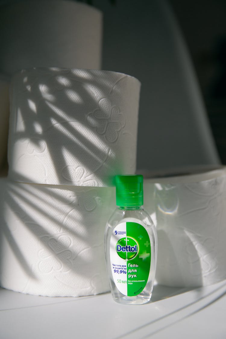 Toilet Paper And Bottle Of Disinfectant