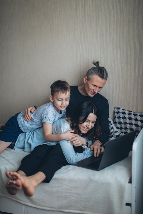 Family Spending Time Together Watching on Laptop