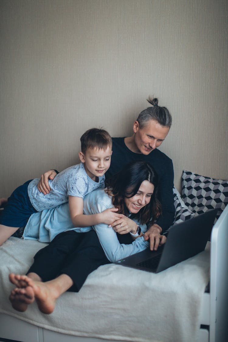 Family Spending Time Together Watching On Laptop