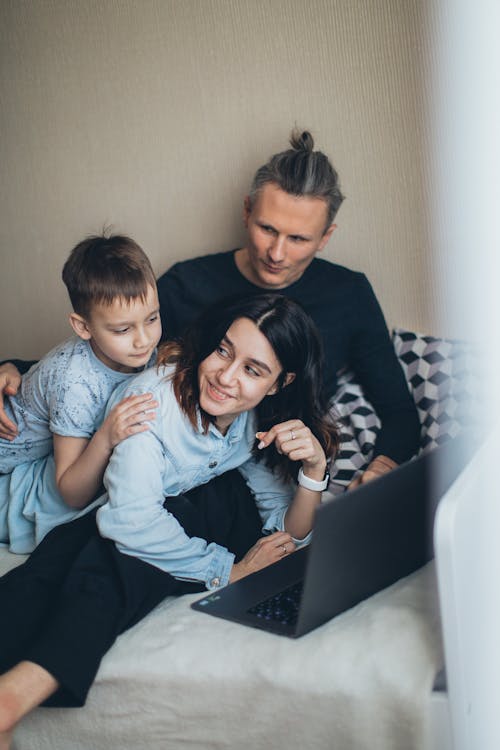 Family Spending Time Together Watching on Laptop