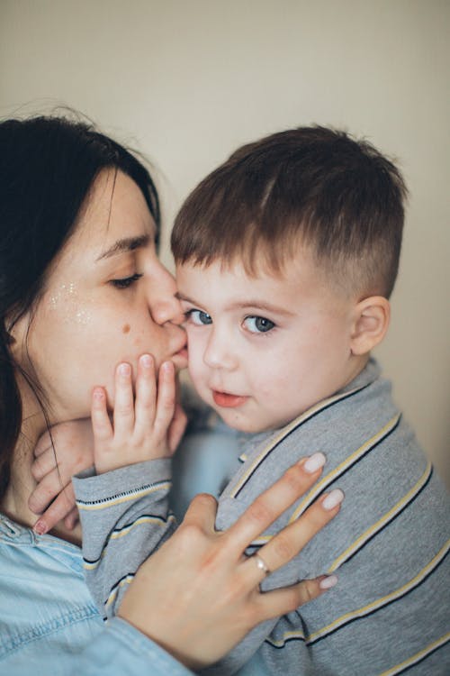 Free Mommy Kissing Little Boy Stock Photo