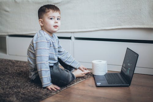 Free Little Boy in front of Laptop Stock Photo