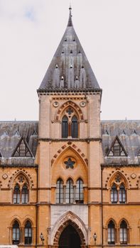 Elegant Gothic Revival facade of Oxford's iconic architectural gem on a clear day.