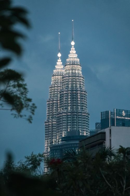 Free Dramatic view of the Petronas Twin Towers at dusk in Kuala Lumpur, Malaysia Stock Photo