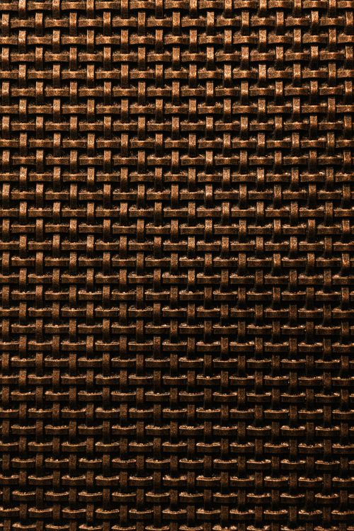 Free Detailed shot of a bronze-colored woven texture with a grid pattern, perfect for design backgrounds. Stock Photo