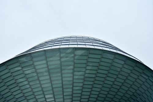 Free Stunning curved glass building showcasing modern architectural design. Stock Photo