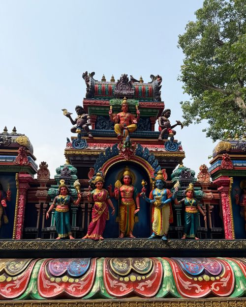 Free Colorful facade of a Hindu temple at Batu Caves, showcasing intricate sculptures under a bright sky. Stock Photo