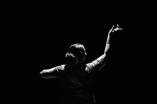Free Black and white silhouette of a Bharatanatyam dancer in graceful pose. Stock Photo