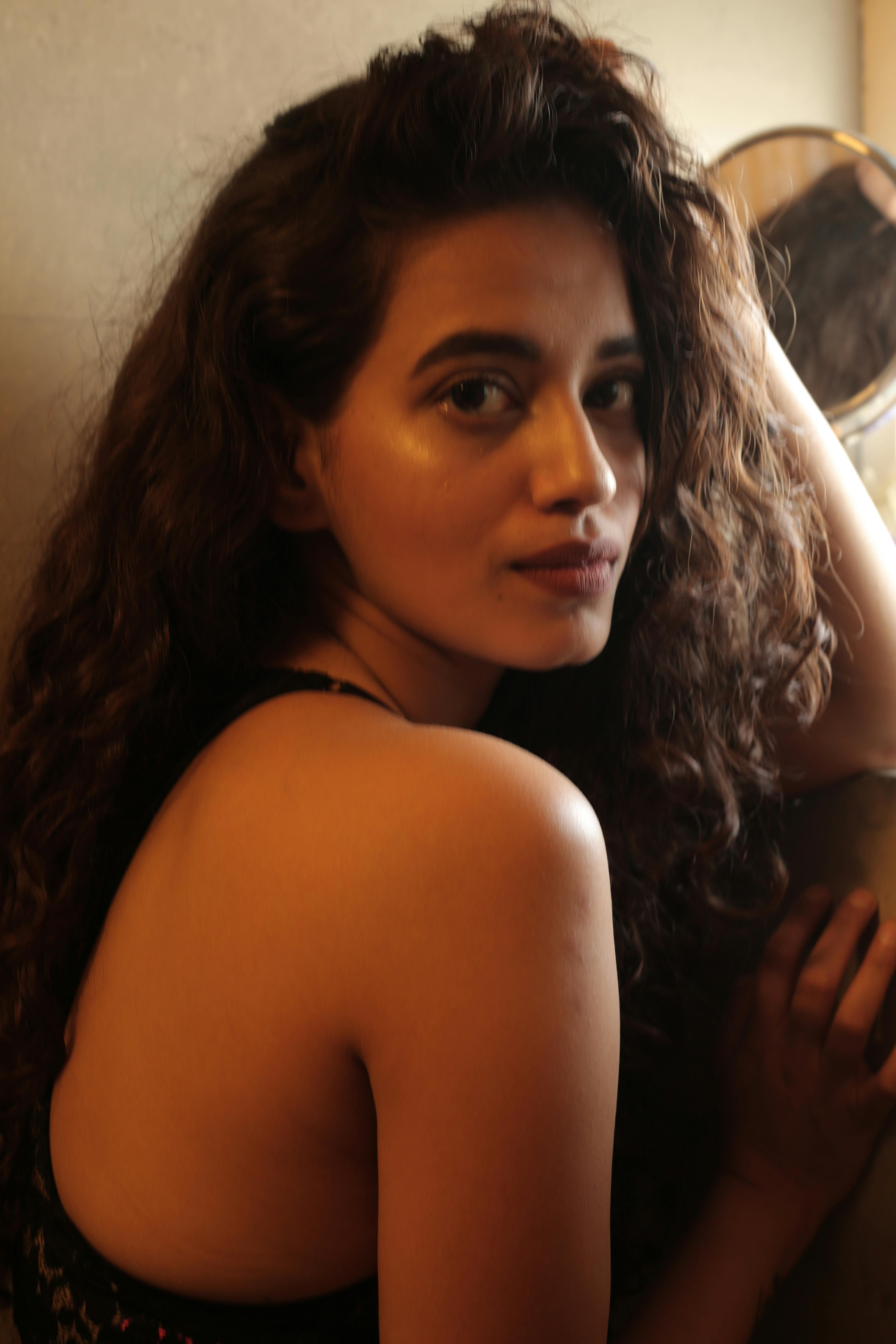 Person carrying a branded canvas tote bag in an urban setting