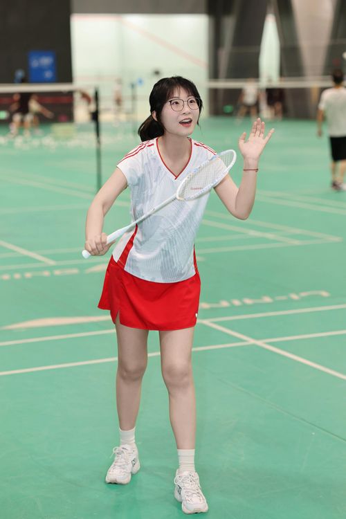 Free A young woman enjoying a game of badminton on an indoor court in Hefei, China. Stock Photo