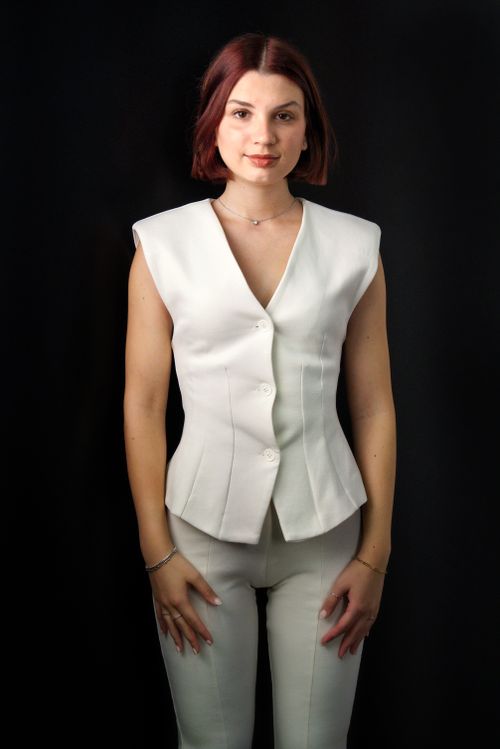 Free Studio portrait of a woman in a stylish white outfit, showcasing modern fashion. Stock Photo