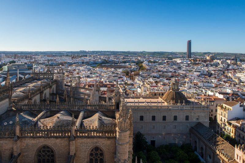 City view, not the stadium: Seville Cathedral and the city's rooftops seen from above, with Torre Sevilla on the skyline.