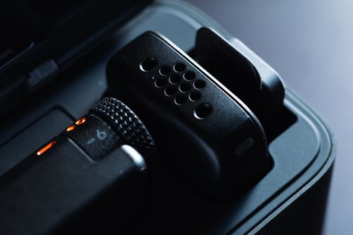 Free Detailed close-up of a professional audio microphone in its casing, highlighting intricate design elements. Stock Photo