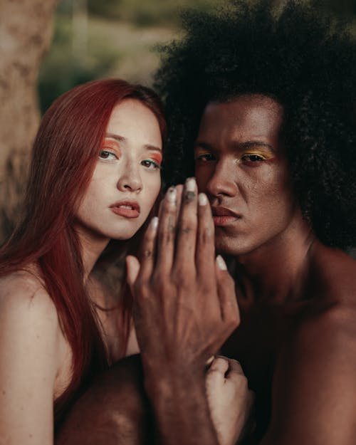 A Man and a Woman Wearing Eyeshadows