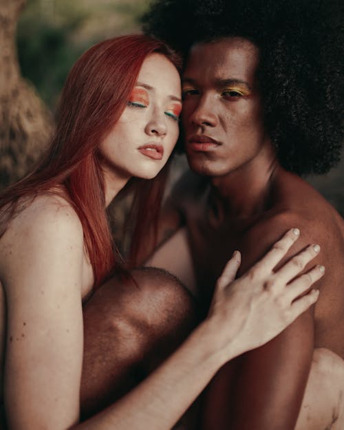 Shirtless Man and a Woman Posing Together