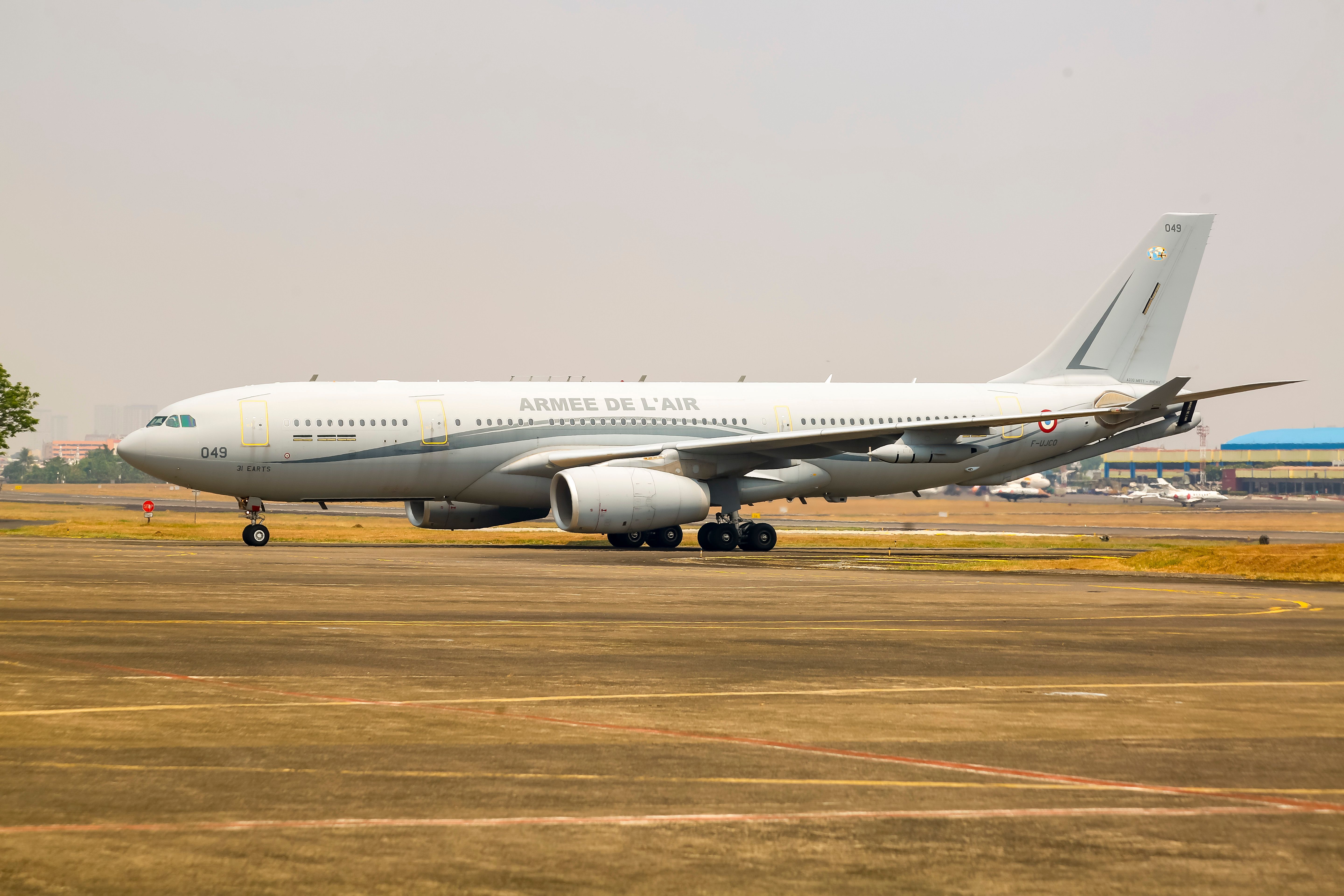 A French Air Force Airbus A330 parked on a runway in Jakarta, Indonesia, on a clear day.
