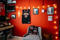 Black and White Jersey Shirt on Red Wall
