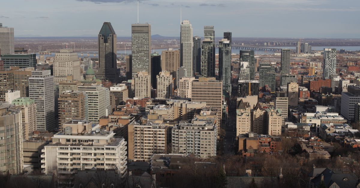 Stunning daytime view of Montreal's skyline with iconic skyscrapers and urban landscape.