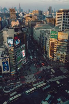 A vibrant aerial view of a busy intersection in Tokyo, capturing the essence of urban life.