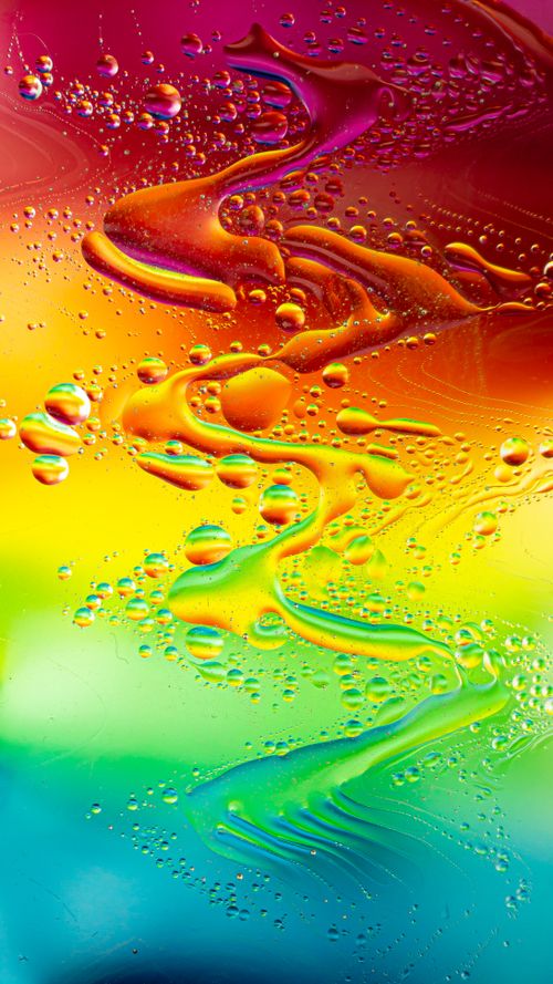Free Colorful abstract image featuring vivid oil bubbles on liquid background. Stock Photo