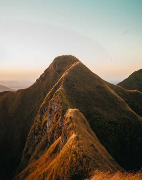 Free Breathtaking view of long high mountain range under clear cloudless endless sky at sunset Stock Photo