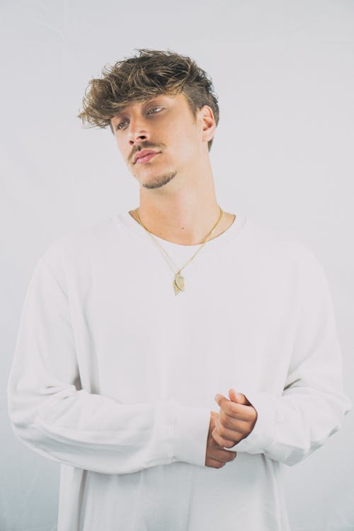 Man in White Long Sleeve Shirt Wearing Gold Necklace