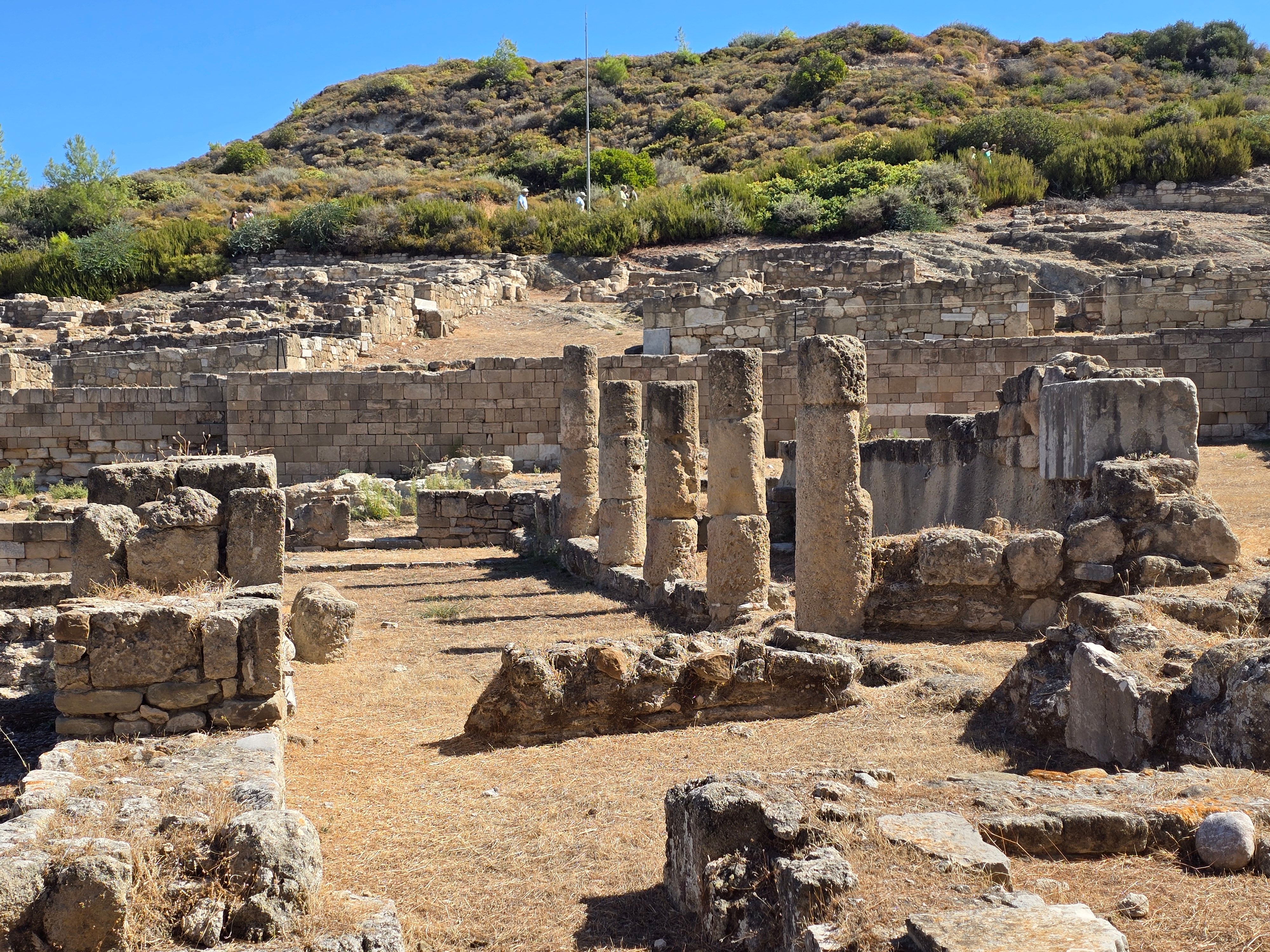 Explore the ancient stone ruins in Cyprus, bathed in summer sunlight, showcasing historical architecture.