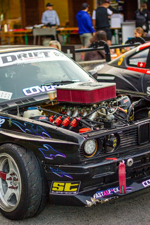 Free Close-up of a drift racing car with exposed engine, showcasing custom modifications. Stock Photo