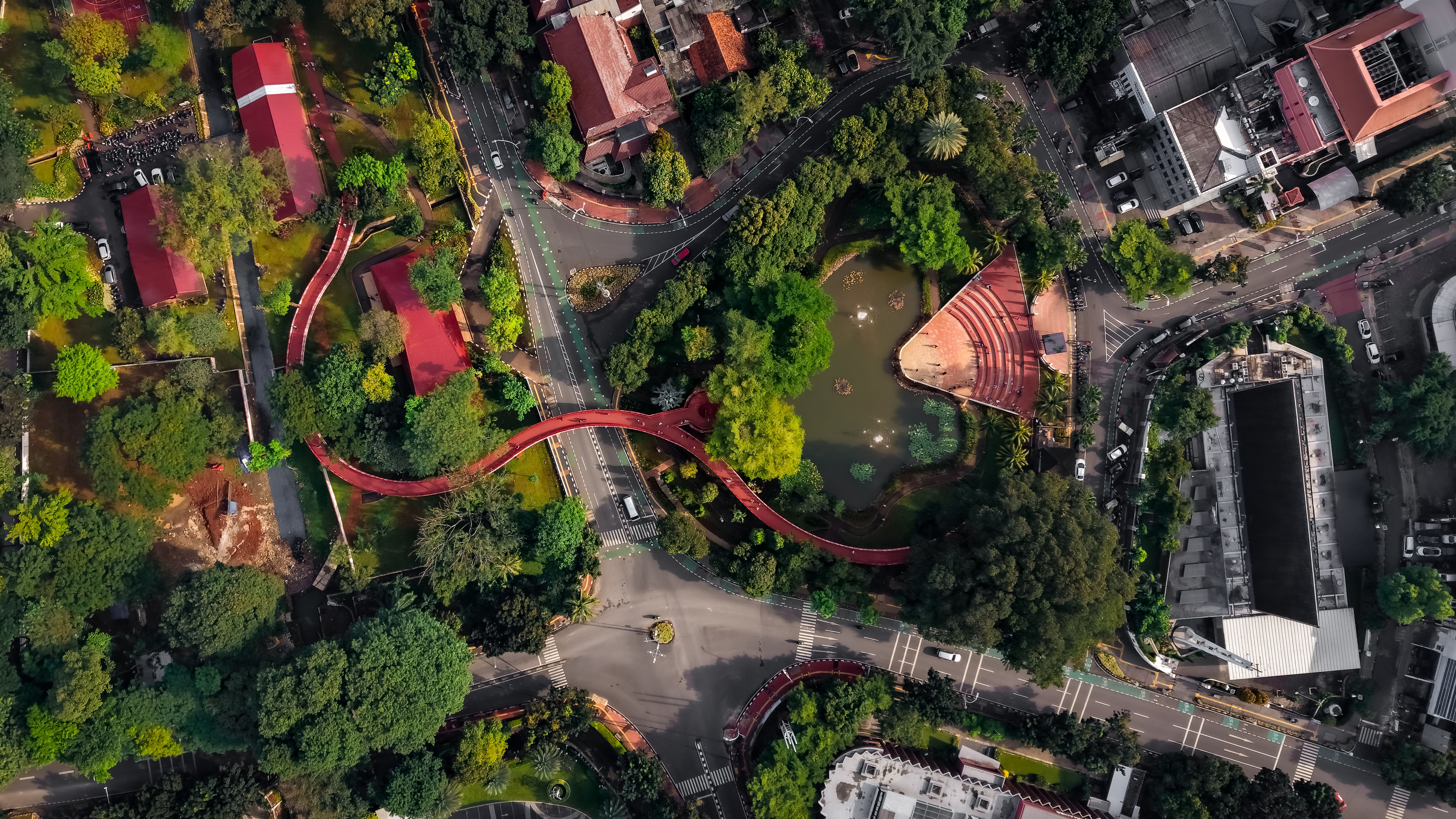 Urban aerial view of Taman Ismail Marzuki Complex, lush greenery and vibrant pathways in Jakarta, Indonesia.
