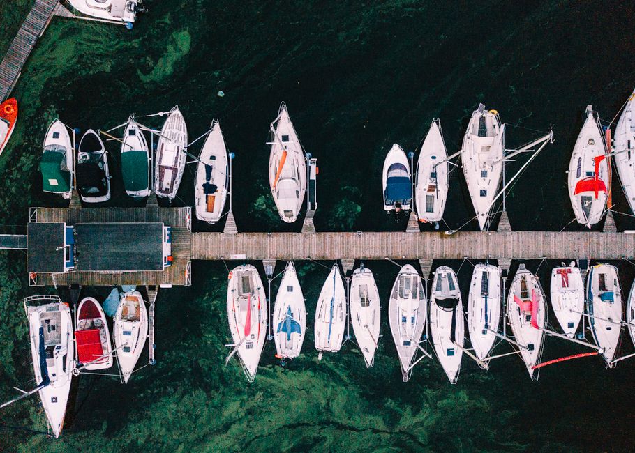 Aerial view of boats moored at a wooden jetty in Kaunas Marina, Lithuania.
